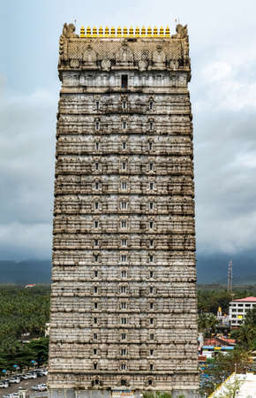 Magnificent 20-storeyed Gopuram at entrance of Lord Shiva Temple in Murdeshwara. Focus on top floors. This stone structure is constructed in traditional Dravidian architecture of Medieval South India.のeditorial素材