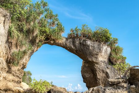 Amazing Natural Coral Bridge of Neil Island (Shaheed Dweep), a geological Arch Rock formation formed off rock erosion, locally known as Howrah Bridge by locals. Clear Pristine blue sky adds more dramaの写真素材