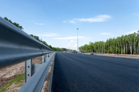 Road impingement on the empty new roadの写真素材