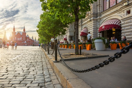 MOSCOW - MAY 16: People sitting in a street cafe on the Red Square near GUM with the Historical Museum on the background on May 16, 2014 in Moscow. Red square recognized as a UNESCO World Heritage Site.のeditorial素材
