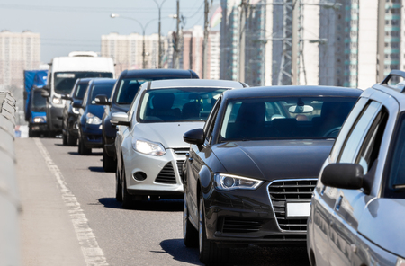 Generic cars standing in a queue during traffic jam