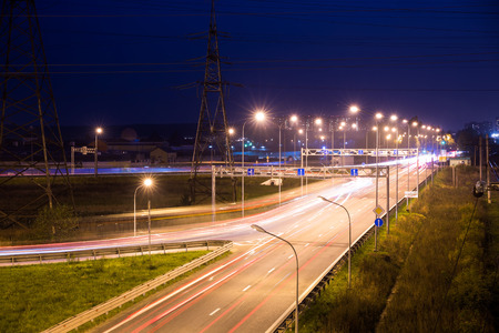 Light trails at night on the highway