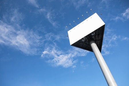 Empty white triangle billboard on the sky background.の写真素材