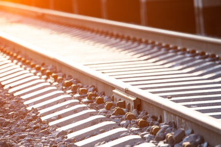 Perspective view of the railway path with sunset on the backgroundの写真素材