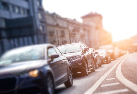 View from below to the lane with cars in traffic jam with motion effect