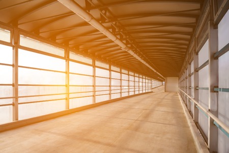 View from the inside to overground pedestrian bridge, lightened by the sunの写真素材