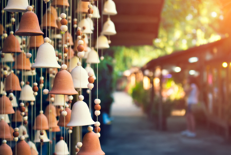 Hand made wind chimes hanging on a string with depth of field effectの写真素材