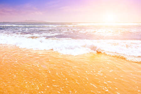 Beautiful waves of the pacific ocean at sunset in La Serena, Chileの写真素材