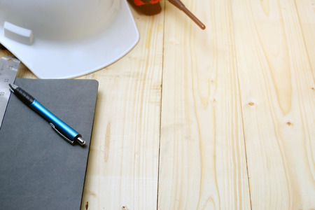 Work desk, construction area with notebook,head protection,radioの写真素材