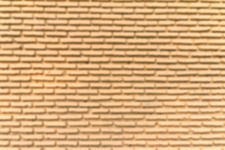 Blur focus yellow brick wall  closeup backgroundの写真素材