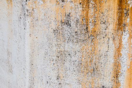 Old white cement wall with rust texture