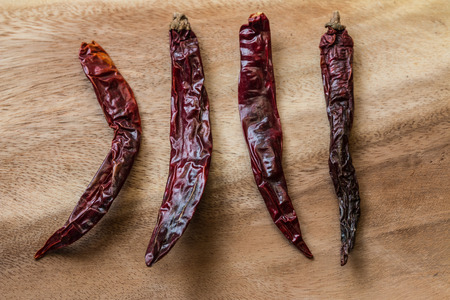 Closeup of the dried chilli on the woodの写真素材