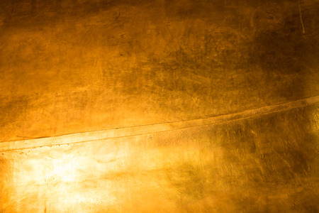 Closeup of gold color and texture on the metal backgroundの写真素材