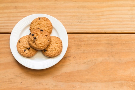 Chocolate chips cookies  on the white dish with free space in right sideの写真素材