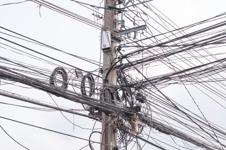 Disarrangement Concept, Tangled Electrical Wire on Electricity Post