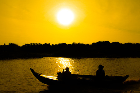 Boat freshwater lake sunset Cambodiaの写真素材