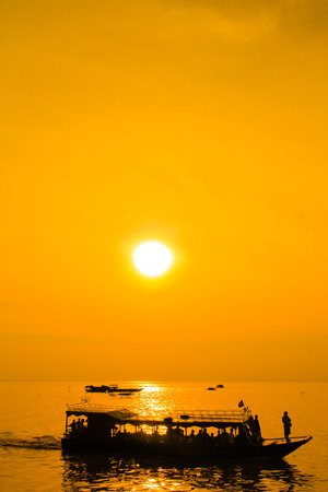 Boat freshwater lake sunset Cambodiaの写真素材