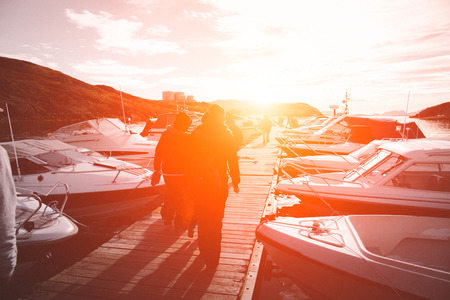 public beautiful harbor buil in old style by wood and light use for summer time. old port boat wood bridge transport. sunset backgroundの写真素材
