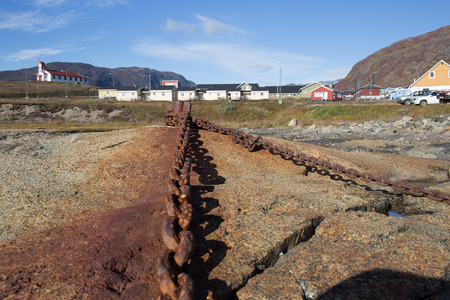 old chain rusty link from stone to sea. metal rusty texture.old and strong concept by retro colourの写真素材