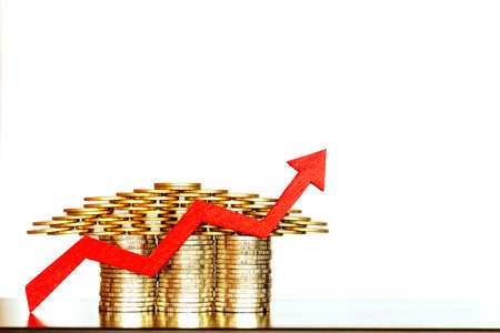Stacked coin  made of home and red arrow graph with growing value on white background for currency...