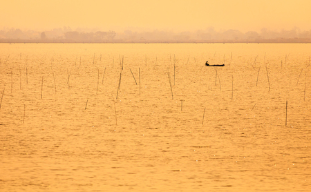 boat in lake at sunset time,golden timeの写真素材