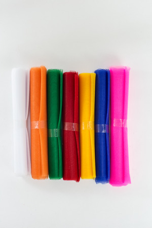 Colored cloths, religions, beliefs isolated on white backgroundの写真素材