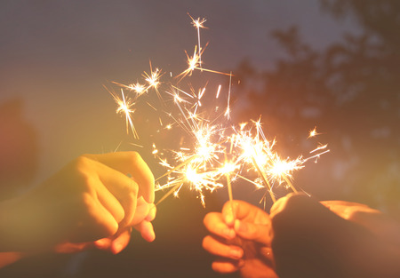 Abstract blur sparklers for celebration christmas,festival and party background,Motion Blurred Sparklers in woman hand holdingの写真素材