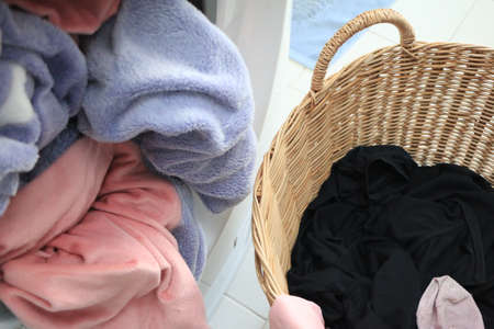 preparation for laundry process. Modern washing machine standing inside bright apartment light...
