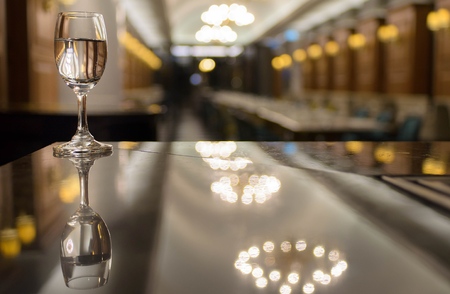 Drink water in cocktails Glass on the bar counter and Blured background,restaurantの写真素材