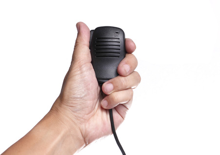 Hand Holding Radio Microphone on White backgroundの写真素材