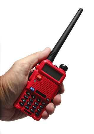 Hand holding Red Radio transceiver on White backgroundの写真素材