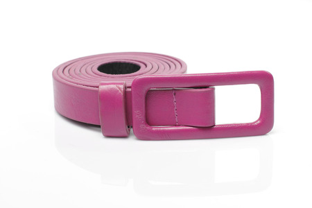 Pink leather belt in White backgroundの写真素材