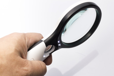 Magnifing Glass with Light switch in White backgroundの写真素材