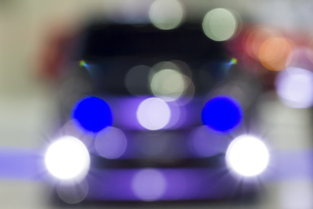 Purple Car with Headlight Blur out of focusの写真素材