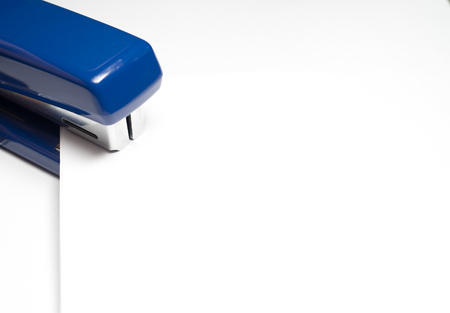 Blank White Paper with Blue Staplerの写真素材