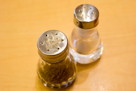 Salt and Pepper bottle on Tableの写真素材