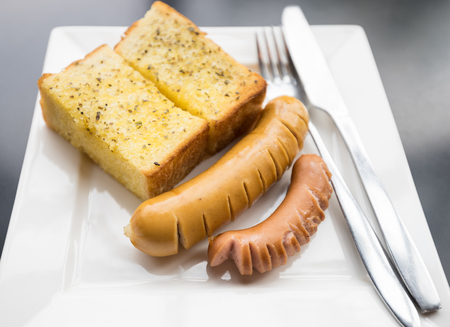 Homemade Cheese Bread sausage on White dishの写真素材