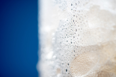 Ice Condensation Glass with Blue background Macro shotの写真素材