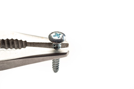Pliers with Screw on White backgroundの写真素材