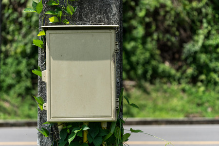Old Electric box on post with blur backgroundの写真素材