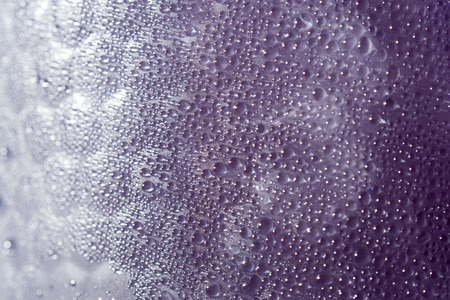 water condensation on Purple Juice in Ice glass macro shot texture