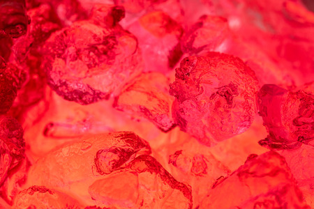 Red juice in glass with ice  macro shotの写真素材