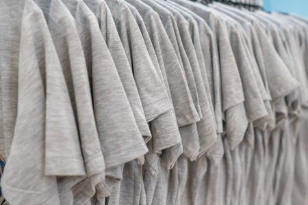 Casual Gray T-shirts hanging row in clothes shop