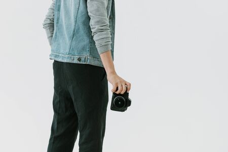 Camera man holding camera with handの写真素材