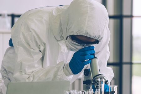 Lab Technician in Personal protective equipment  PPE suit Vaccines testing of Virus looking to...
