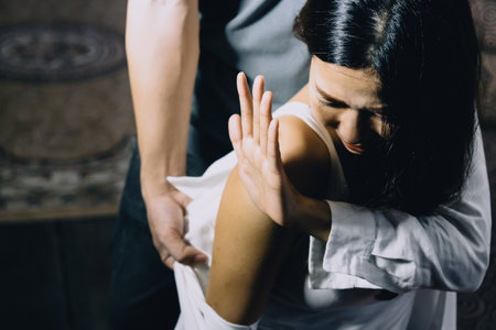 Asian women being raped With raped men holding standing Wearing jeans After raped the woman Atmosphere gloomy, dangerous, vandalism, physical abuse, women, violence, victim of sexual crimeの写真素材