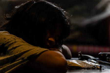 Asian women are injecting drugs into their arms In a dim, gloomy, scary atmosphereの写真素材