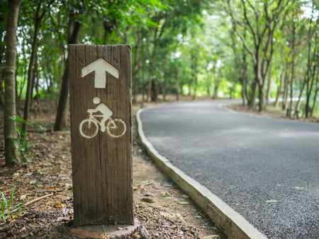 wooden notice of  bicycle laneの写真素材