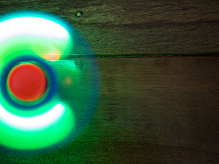 Moving hand spinner with lightの写真素材
