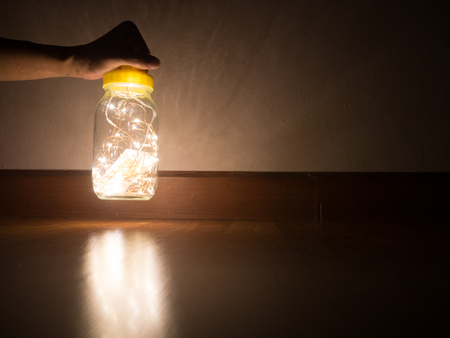 Hand hold Wired led lamp in glass bottleの写真素材